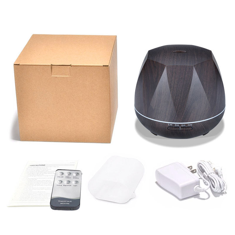 Aroma diffuser kit with dark unit, remote, power adapter, manual, and mist pads