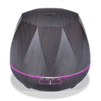 Dark wood grain aroma diffuser with magenta LED ring and control buttons