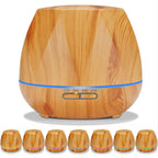 Light wood grain aroma diffuser with blue LED ring; set of small diffusers shown