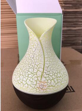 Cream wood grain aroma diffuser with cracked glow top and light base