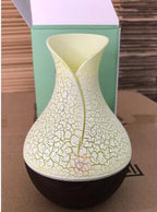 Cream wood grain aroma diffuser with cracked glow top and light base