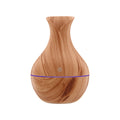 Light wood grain aroma diffuser with blue light band and power button