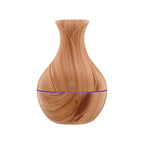 Light wood grain aroma diffuser with blue light band and power button