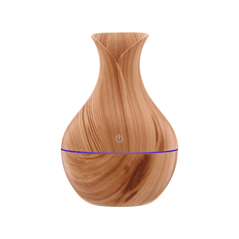 Light wood grain aroma diffuser with blue light band and power button