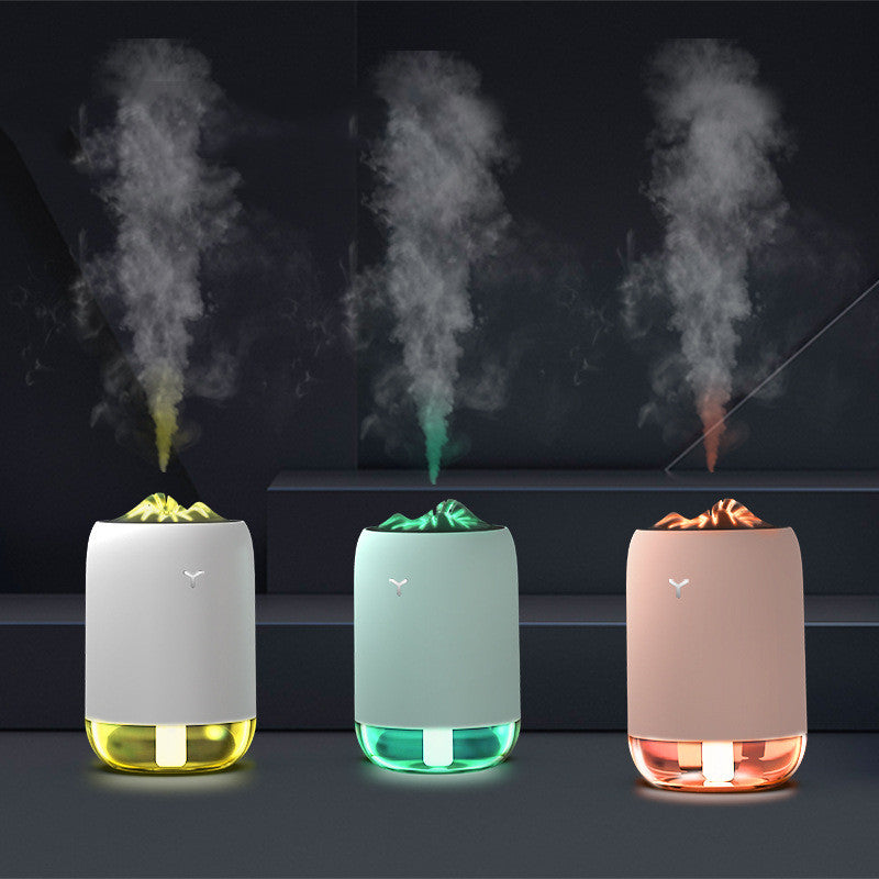 USB aroma diffuser with mist, showing white, light green, and pink bases and glow tray