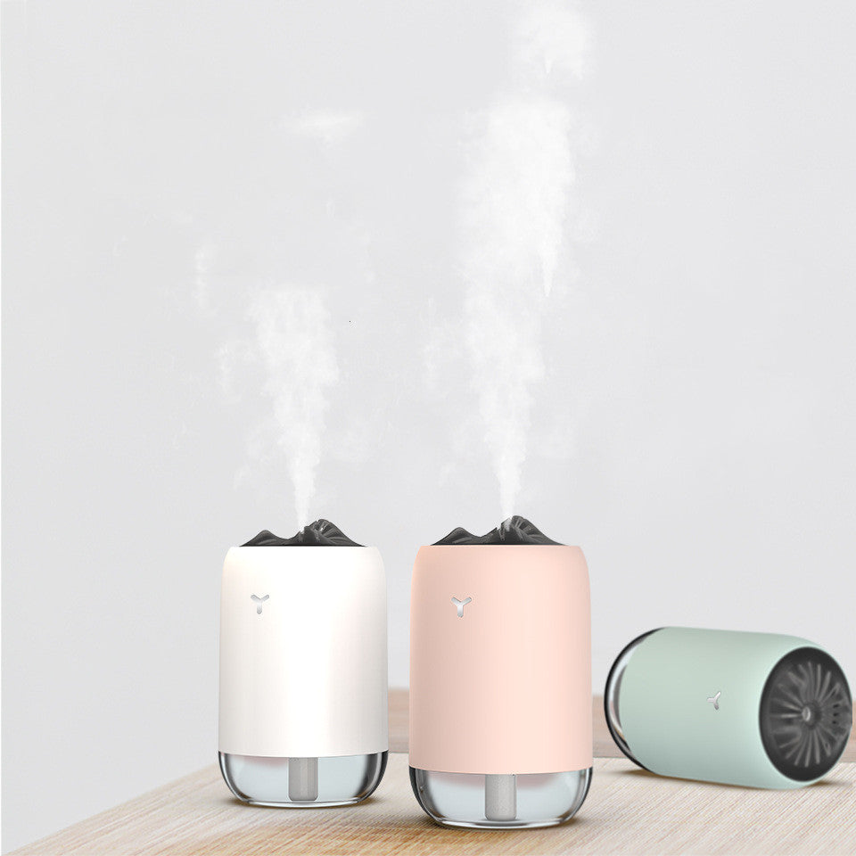 Set of USB aroma diffusers with mist: white and pink units plus light blue canister