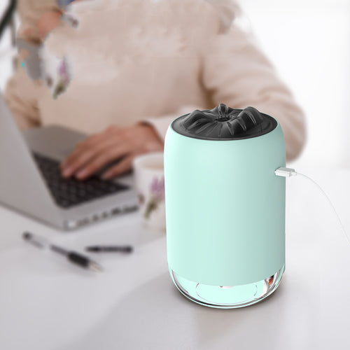 Light blue USB aroma diffuser with top nozzle, mist output, and side USB cable