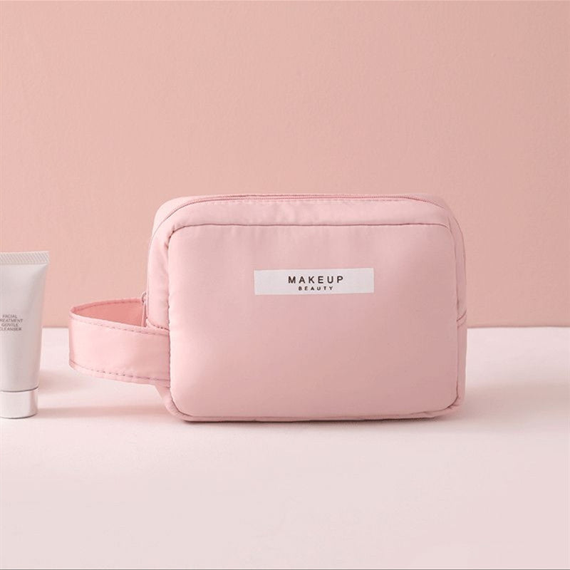 Pink compact makeup travel pouch with side pocket and zip front