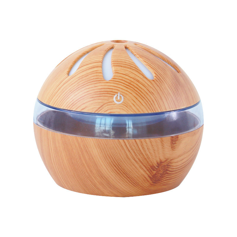 Light brown wood-grain mist diffuser dome with blue translucent base and power icon