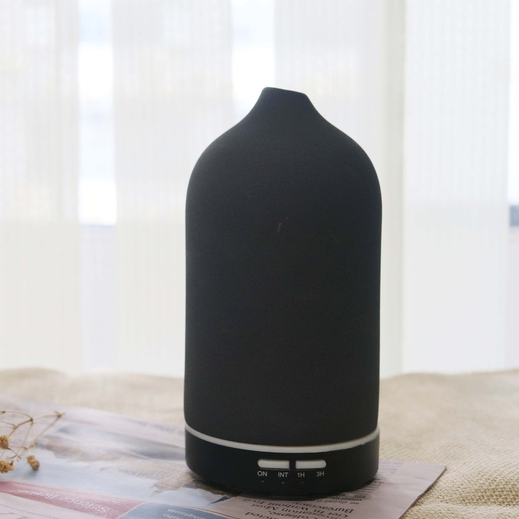 Dark gray ceramic aroma diffuser with rounded top and base control buttons