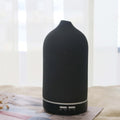 Dark gray ceramic aroma diffuser with rounded top and base control buttons