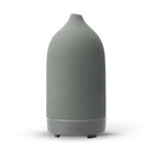Ceramic aroma diffuser in gray, tall tapered bottle with silver ring and feet