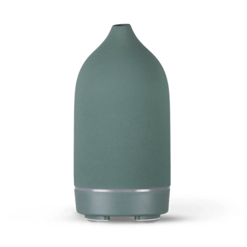 Teal ceramic aroma diffuser with smooth curved body and dark base ring