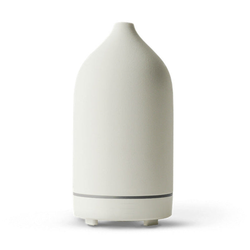 Ivory ceramic aroma diffuser, white bottle shape with base and 3 feet