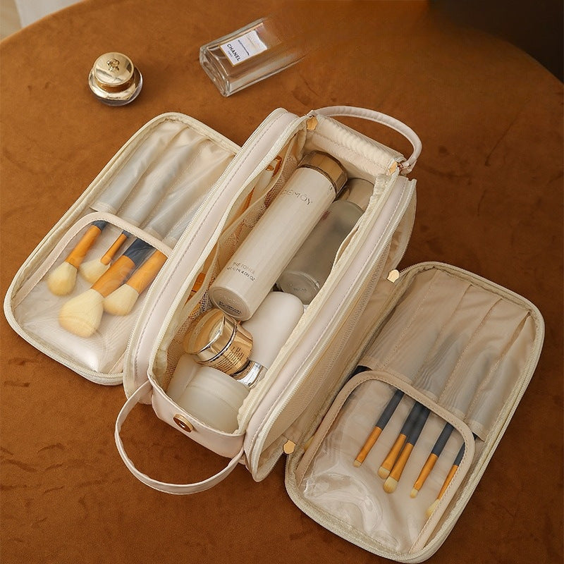 White travel vanity case open with organizer panels, elastic slots, and small bottles