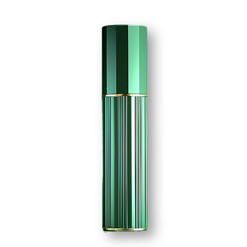 Gold travel perfume atomiser in a hand, mist plume emerging from the spray head