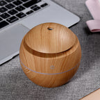 Wood grain aroma diffuser, light wood globe shape with blue power ring and top vent