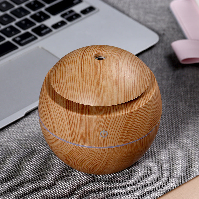 Wood grain aroma diffuser, light wood globe shape with blue power ring and top vent