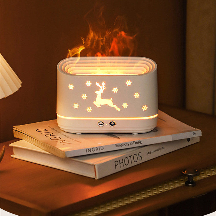 Ivory white elk aromatherapy diffuser on tabletop; glowing top ring and deer silhouette with stars