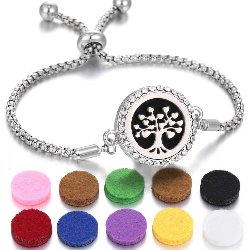 Aroma bracelet with black tree-of-life locket and assorted round felt aroma pads