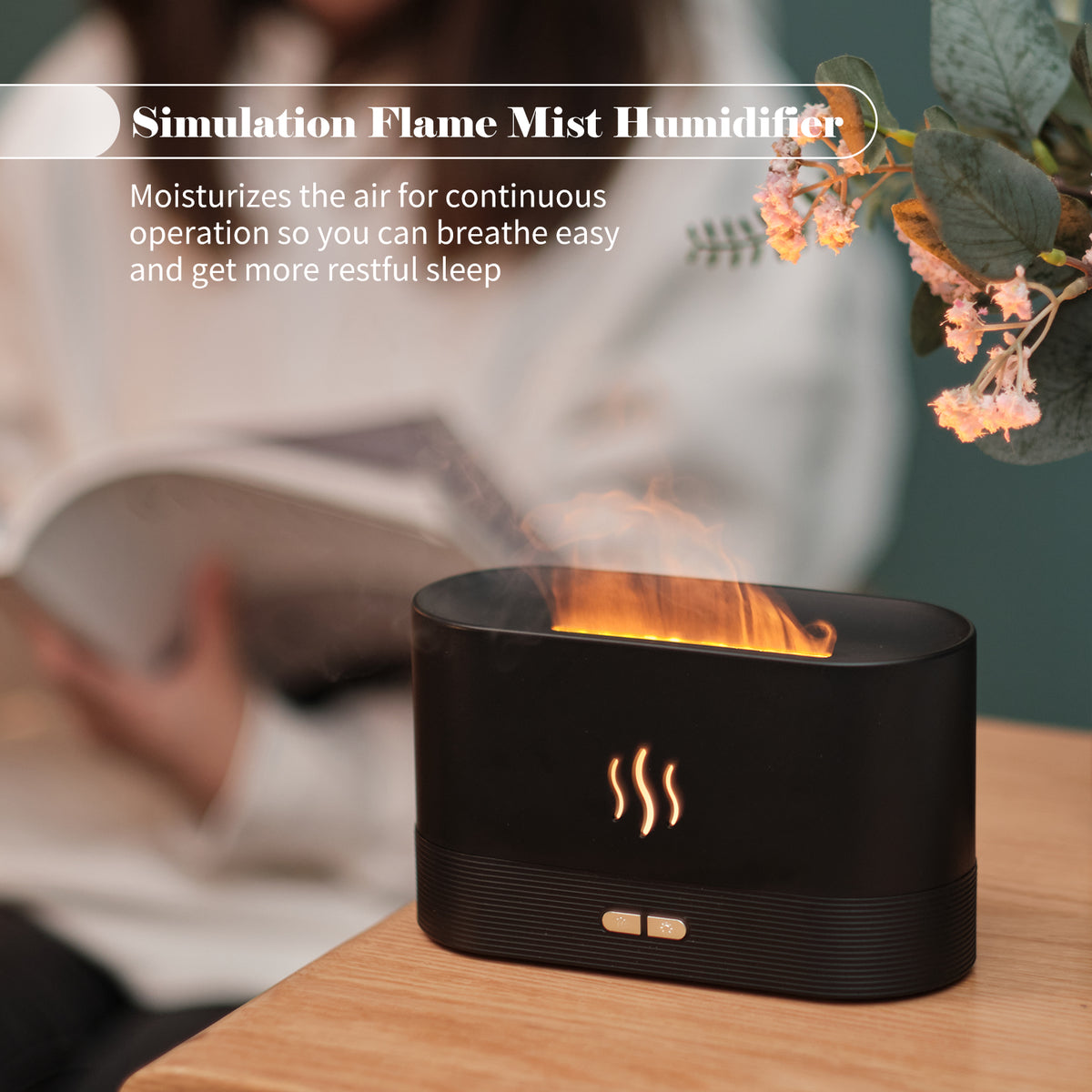 Black flame mist diffuser releasing visible mist with simulated flame