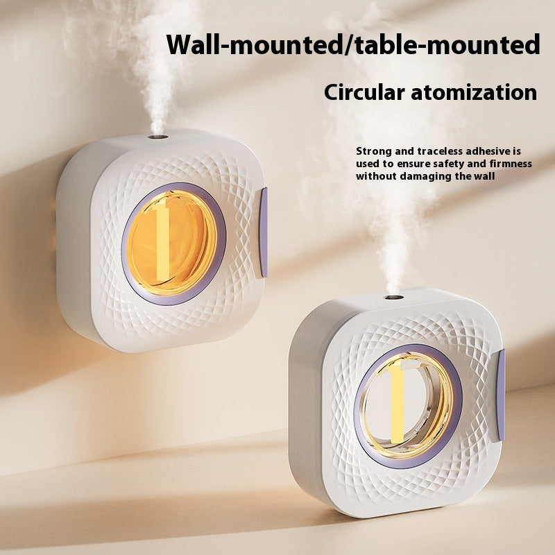 White aerosol diffuser with amber circular window, spraying from top nozzle