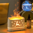 Ivory white sculptural elk diffuser with glowing ring and lit deer silhouette with snowflakes