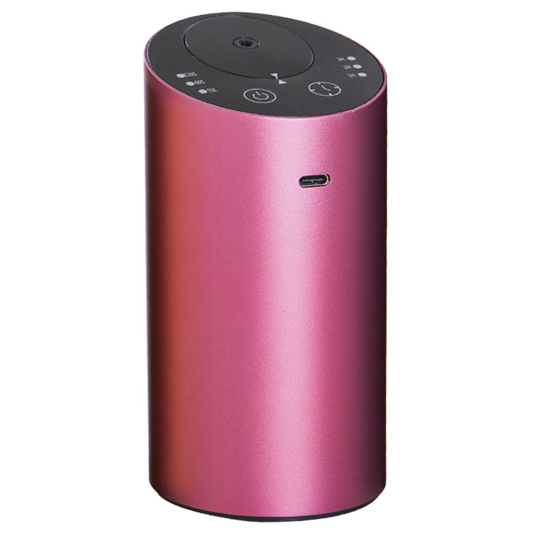 Purple cylindrical portable USB diffuser with top control panel and USB charging port.