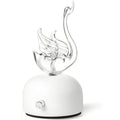 Aroma diffuser with white base and flame-like glass aroma outlet
