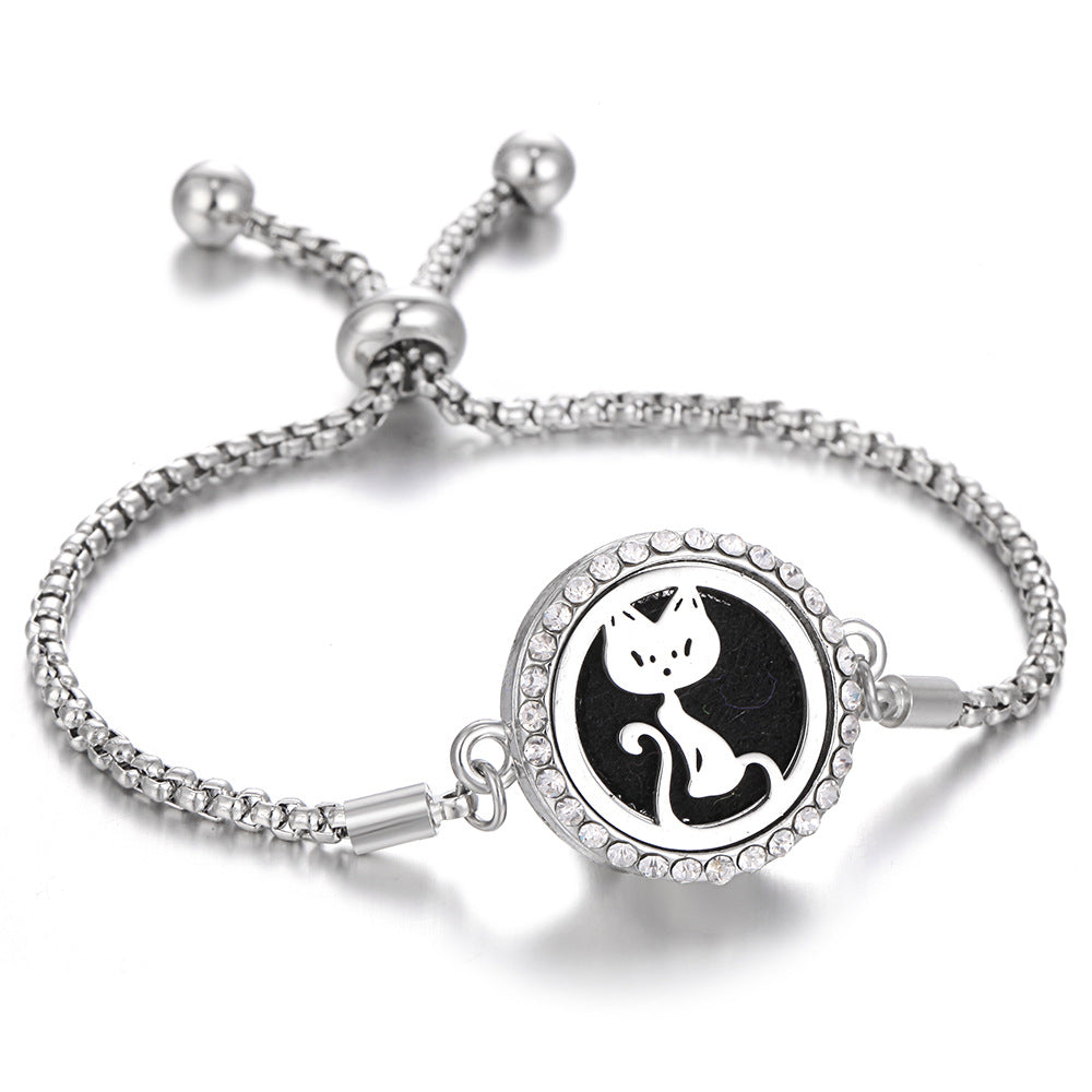 Silver-tone aroma bracelet with black cat silhouette locket and clasp
