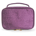 Soft travel cosmetic case in purple with top handle and gold zipper pull