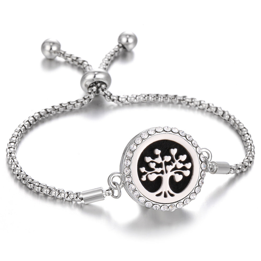 Silver-tone aroma bracelet with white tree-of-life locket and clasp