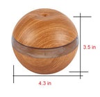Wood essential oil diffuser with clear top band, approx 4.3 in wide and 3.5 in tall