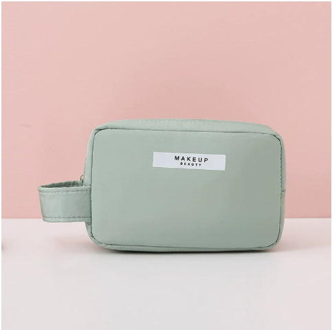 Mint color compact makeup travel pouch with front label and zip closure