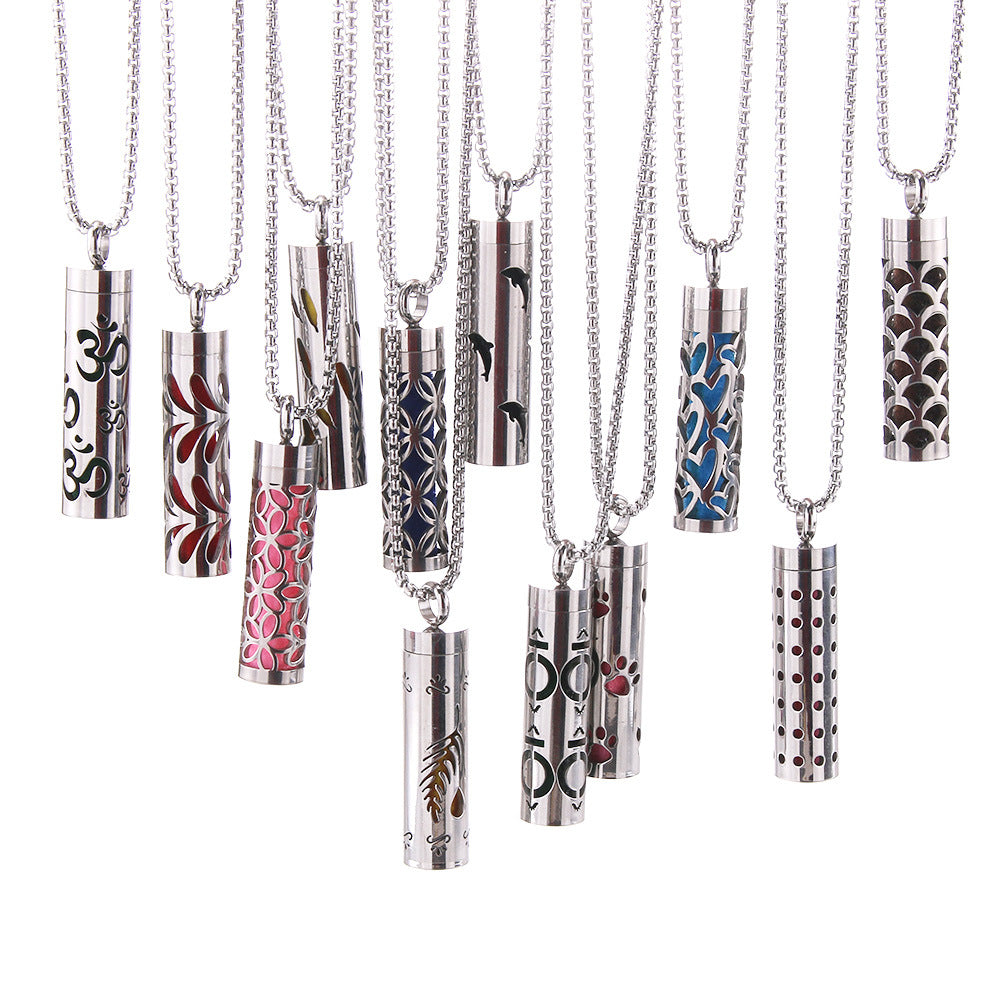 Set of Aroma pendant cylinders with different decorative openings in blue, red, black designs