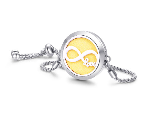 The Ritual Aroma Bracelet in silver tone with yellow “Love” locket