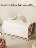 White folding travel vanity bag with two top handles and gold-tone snap clasp.