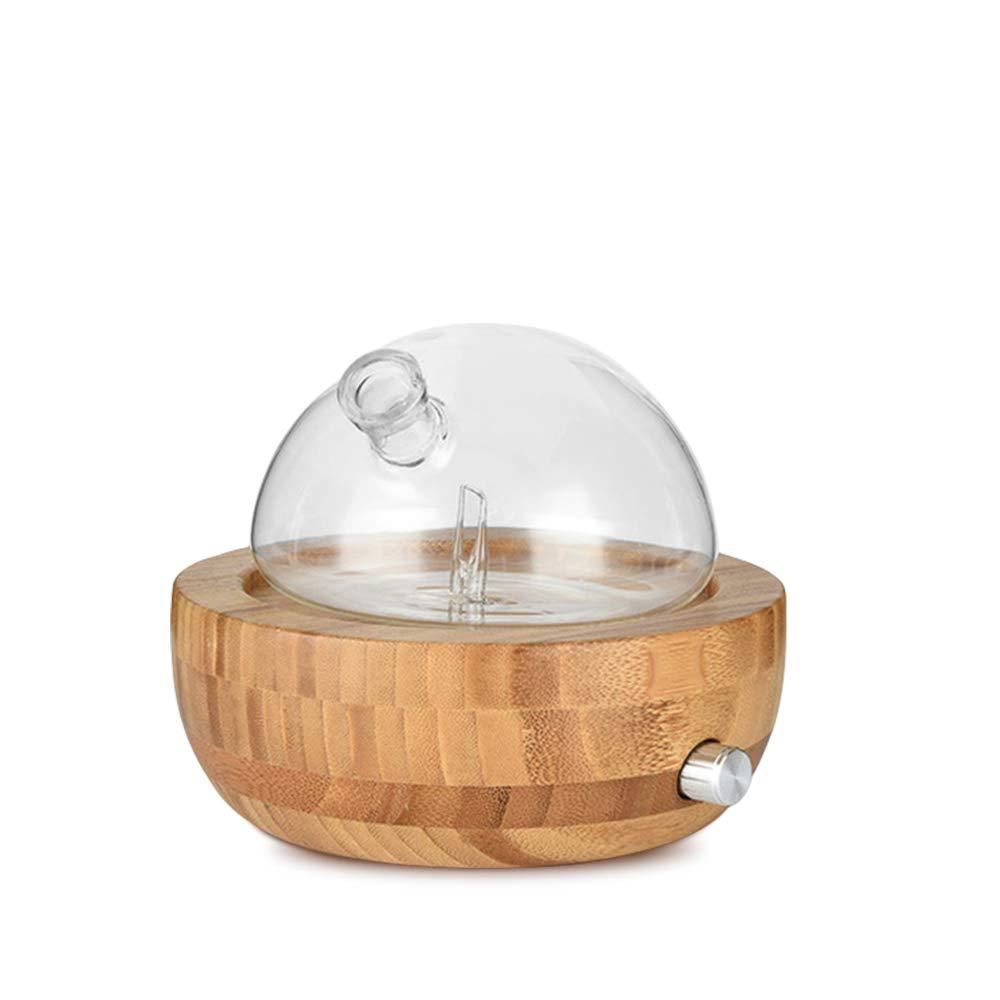 Wood aroma diffuser with clear glass dome on patterned light wood base and knob