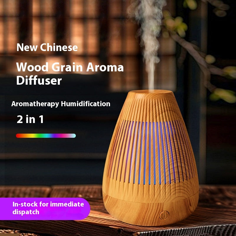 Ultrasonic essential oil diffuser in light wood grain with LED glow and mist stream