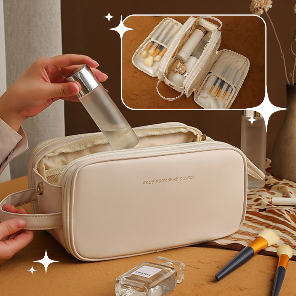 White structured travel vanity case with zip, wrist strap, and open organizer compartments