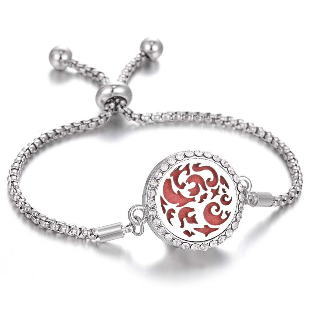 Silver aroma bracelet with red animal motif charm
