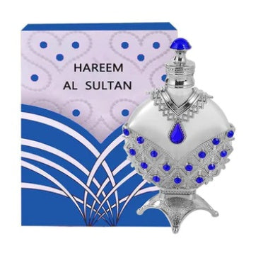 Perfume oil vial with blue gem accents on silver-tone body and ornate silver top