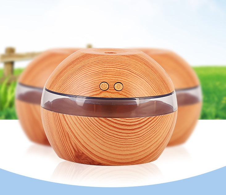 Wood essential oil diffuser with two top buttons and clear mist band