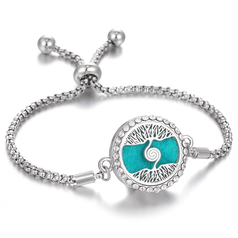 Silver tone aroma bracelet with teal tree landscape charm