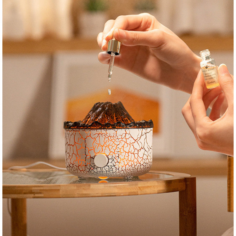 Volcano mist jellyfish diffuser while adding drops into the fill port