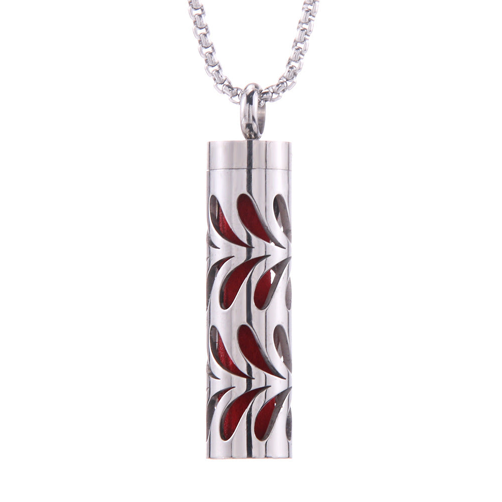 Aroma pendant, silver cylinder with red leaf-like swirl inlay