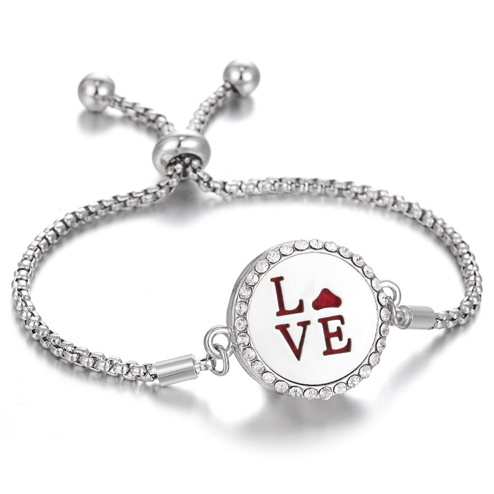 Silver-tone aroma bracelet with red LOVE heart locket and adjustable clasp