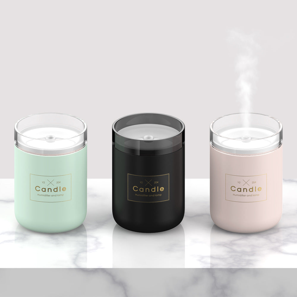 Set of three candle-style aroma diffuser jars in mint, black, and pink