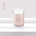 Pink candle-style aroma diffuser jar with clear top and centered label
