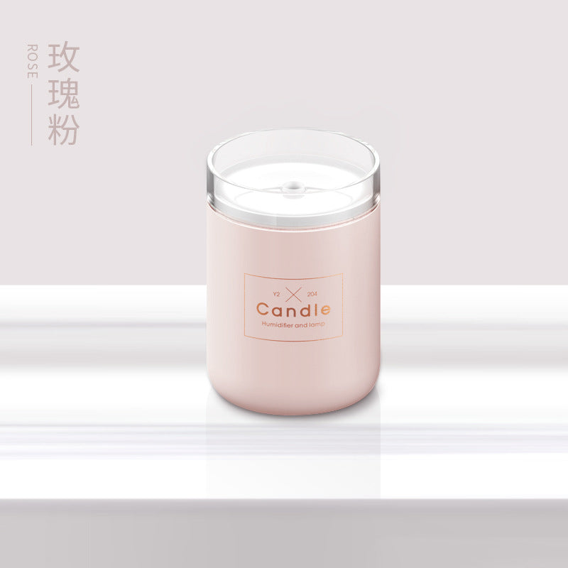 Pink candle-style aroma diffuser jar with clear top and centered label
